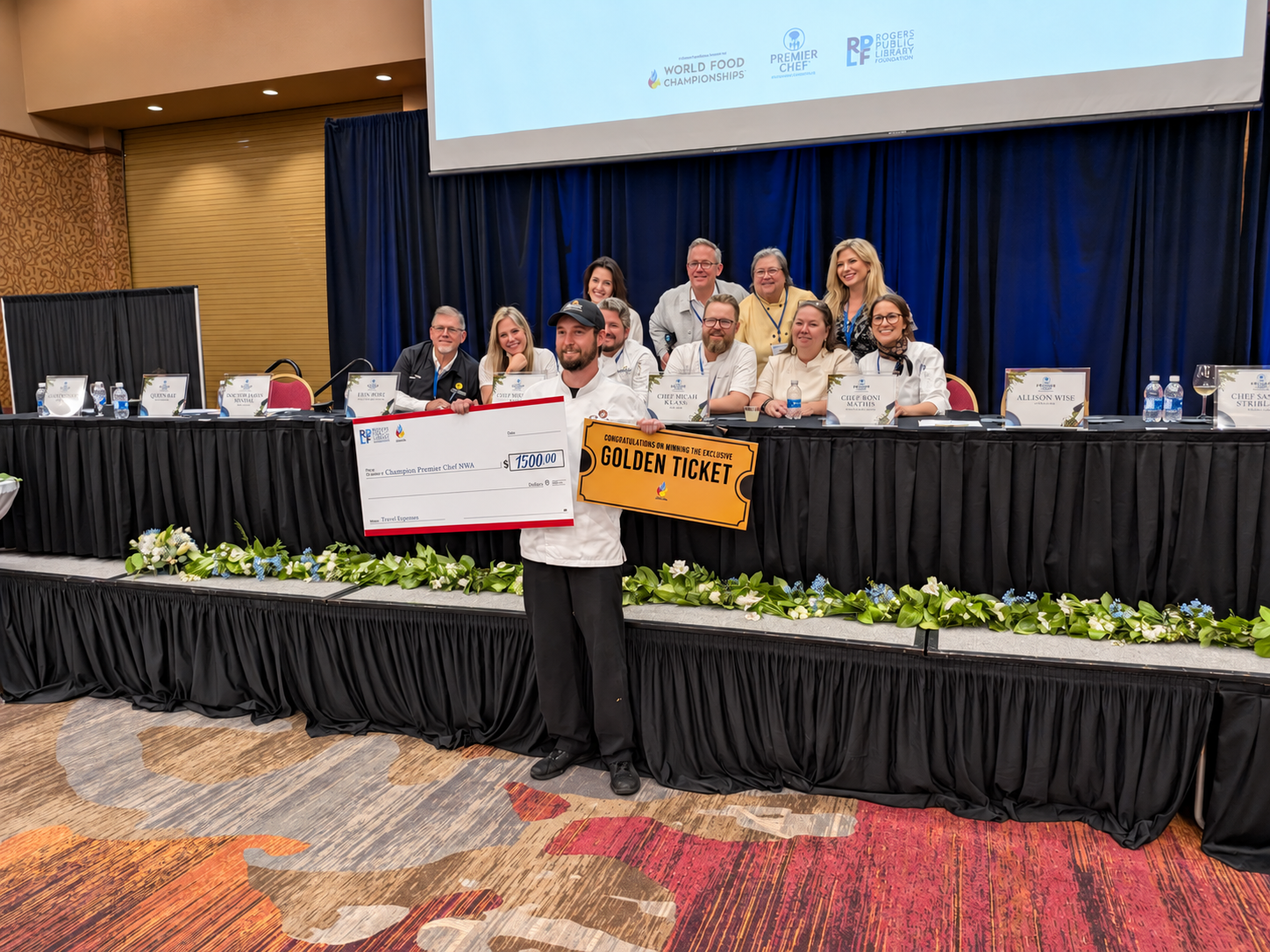 Overall winner Matt Zimmerman holds his check and Golden Ticket in front of the judges